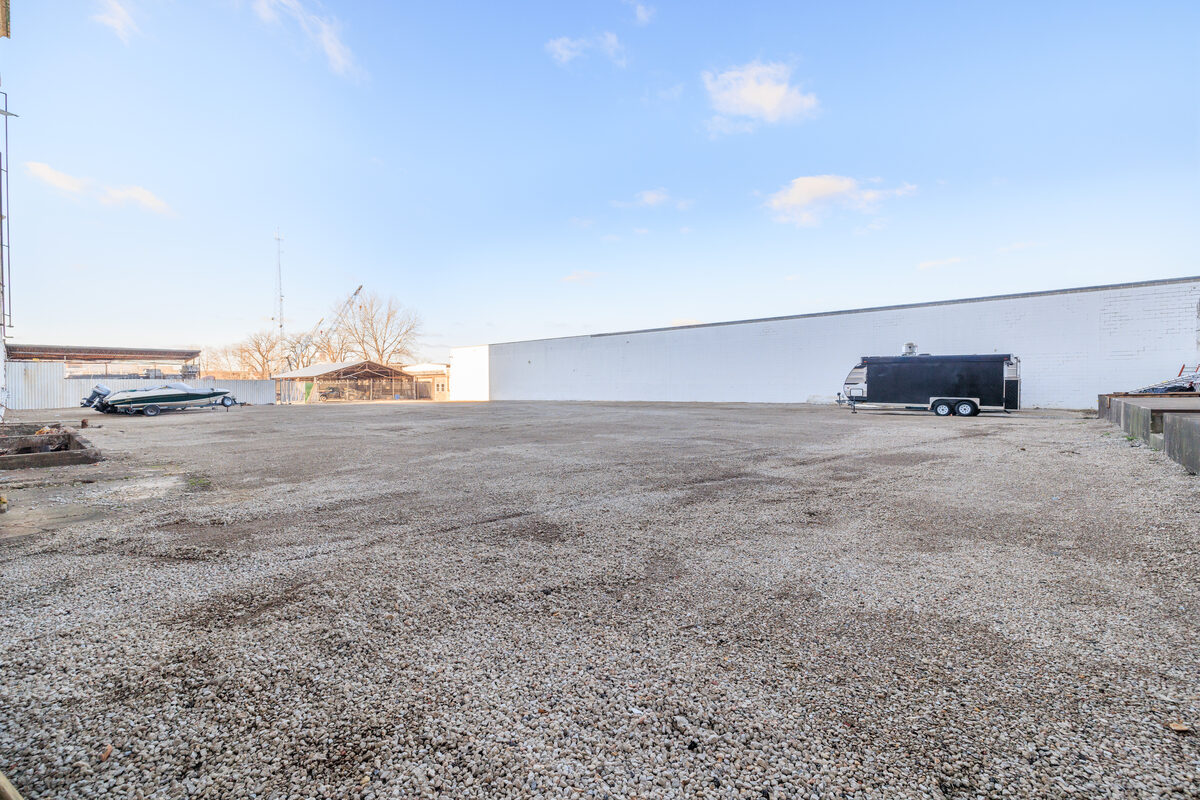 Secured outdoor lot perimeter along facility exterior