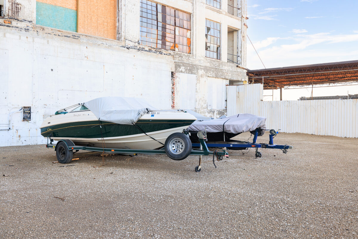 Covered trailers and oversized vehicles in outdoor storage area